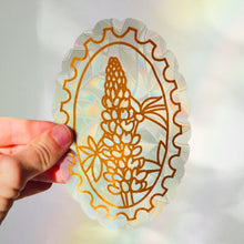 Load image into Gallery viewer, Holographic sticker with a pineapple design held by a hand against a blurred background

